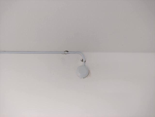 Fibre entering wall to avoid door